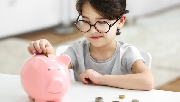 Child and piggy bank