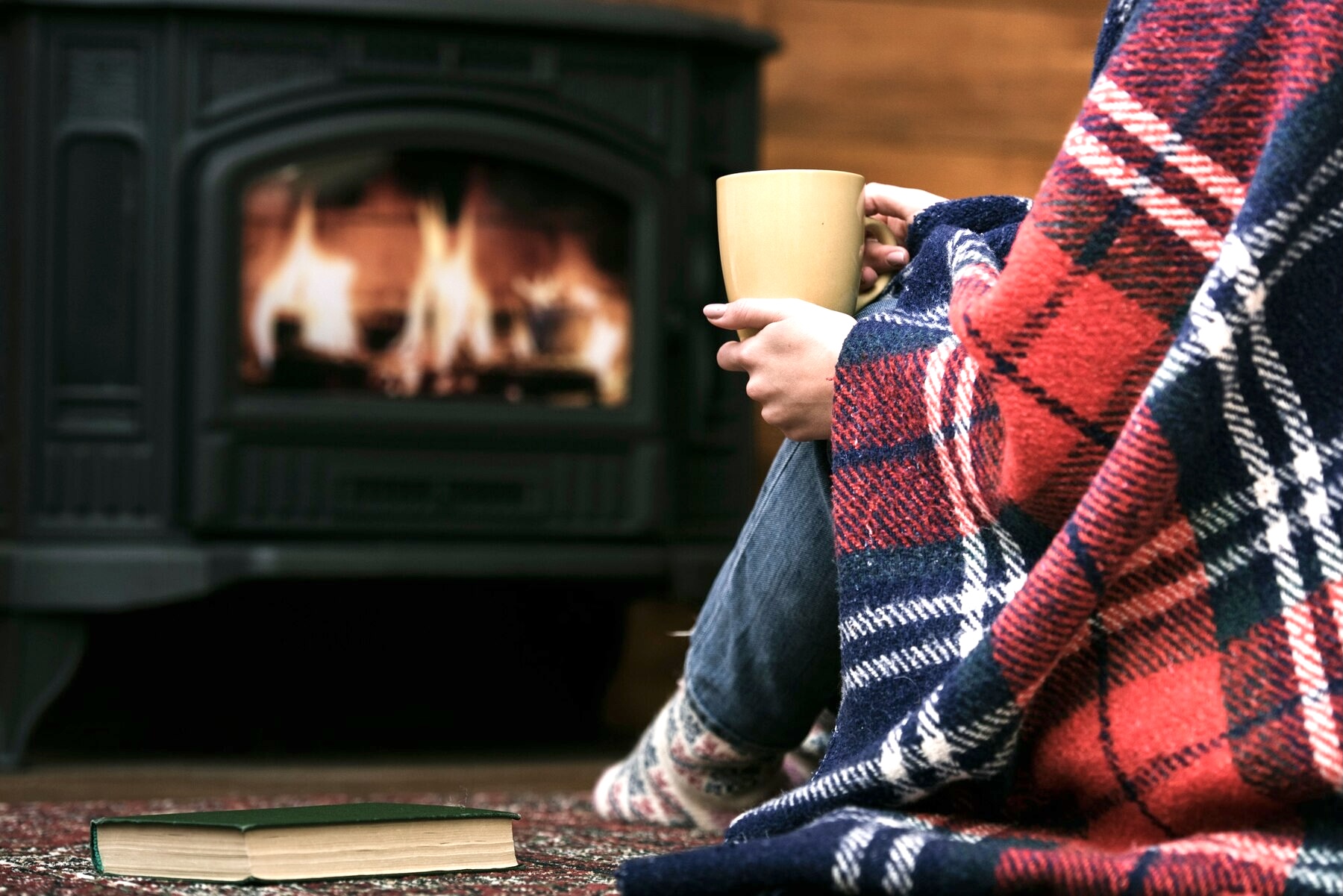 Fireplace, warm blanket, drinking hot cocoa girl