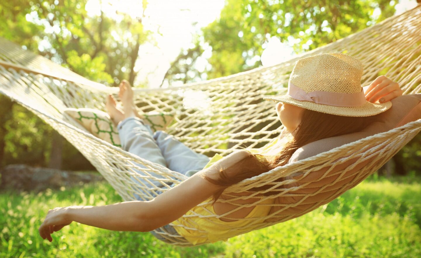 Woman resting in a hammock