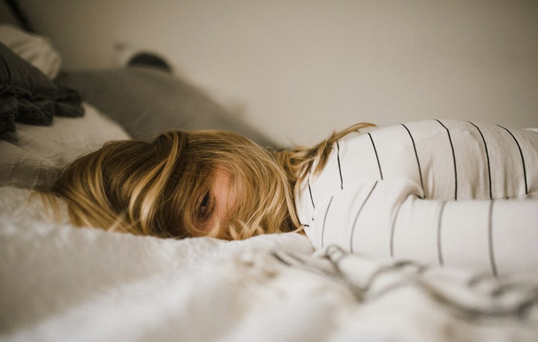 woman lying on bed