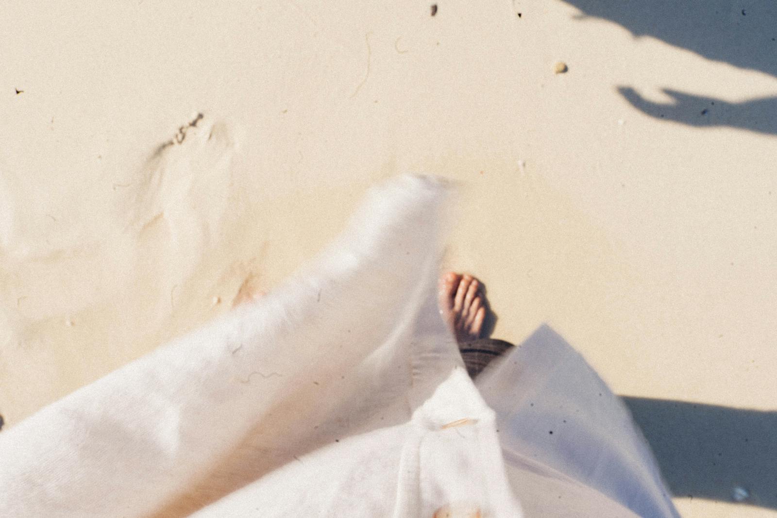 A peaceful barefoot stroll along the sandy beaches of Krabi, Thailand.