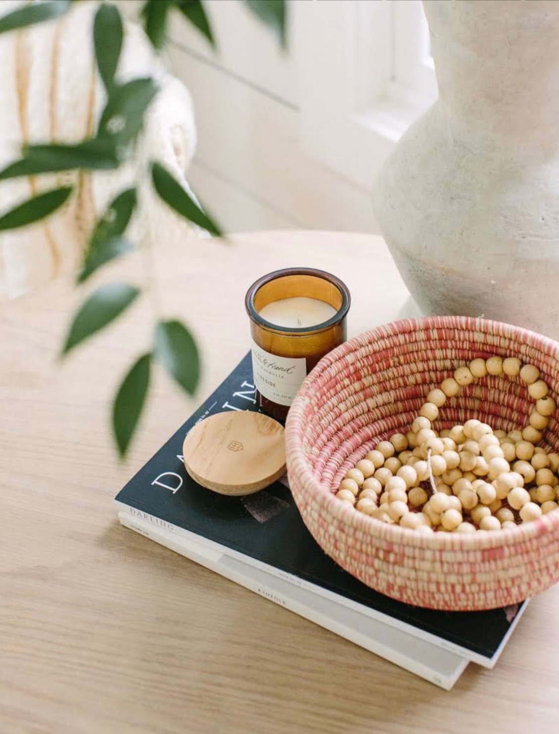 Basket with jewelry candle and book